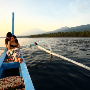 A couple enjoys boating at Spa Village Resort Tembok, Bali